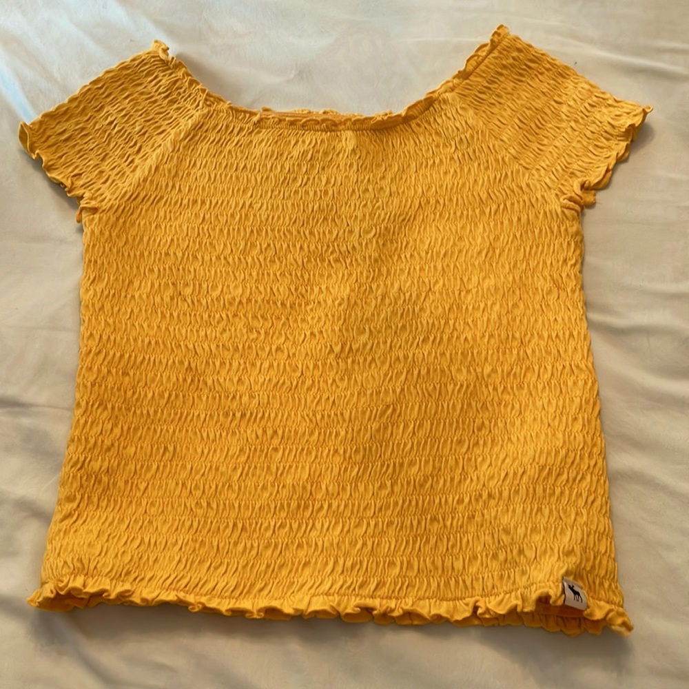 The shirt that i’m selling is a nice yellow shirt that is from abercrombie kids.